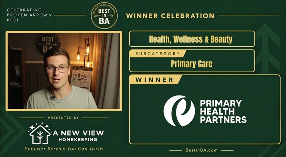 Best-primary-care-in-broken-arrow - Dr. Ashley Pojezny, Do - Primary Care Physician Award celebration banner featuring a man on the left and a green-gold layout announcing the winner in Health, Wellness & Beauty—Primary Care (Primary Health Partners)